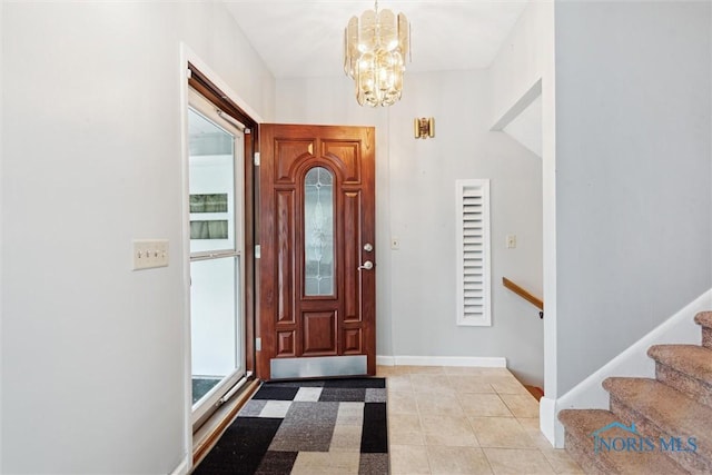 1639 Brookside Dr, Findlay, OH 45840 - entrance foyer featuring a chandelier, light tile patterned floors, baseboards, and stairs