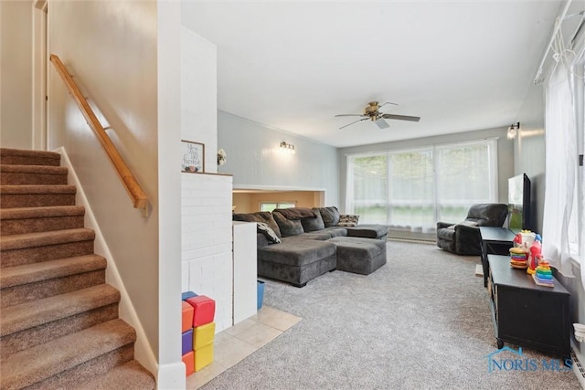 1639 Brookside Dr, Findlay, OH 45840 - carpeted living area featuring a ceiling fan and stairs
