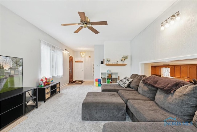 1639 Brookside Dr, Findlay, OH 45840 - living room featuring ceiling fan, light carpet, and a chandelier