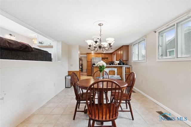 1639 Brookside Dr, Findlay, OH 45840 - dining room featuring a chandelier and light tile patterned floors