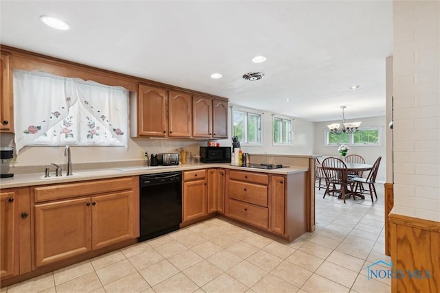 1639 Brookside Dr, Findlay, OH 45840 - kitchen with black appliances, a sink, a peninsula, light countertops, and recessed lighting