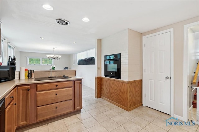 1639 Brookside Dr, Findlay, OH 45840 - kitchen featuring black appliances, a chandelier, light countertops, brown cabinets, and recessed lighting