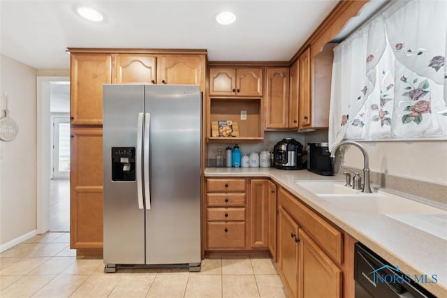 1639 Brookside Dr, Findlay, OH 45840 - kitchen featuring stainless steel fridge, light countertops, light tile patterned floors, black dishwasher, and recessed lighting