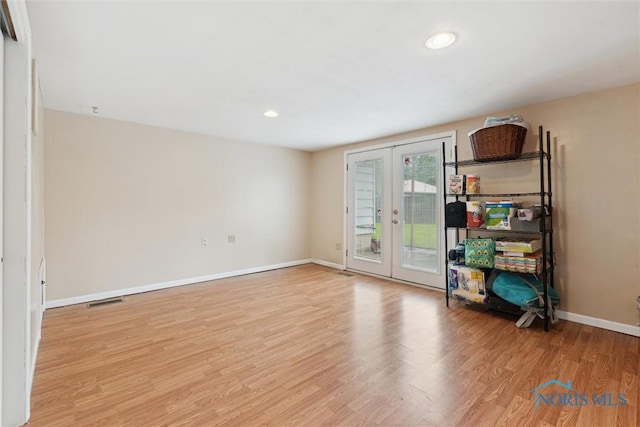 1639 Brookside Dr, Findlay, OH 45840 - unfurnished room with french doors, wood finished floors, baseboards, and recessed lighting