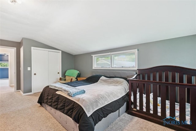 1639 Brookside Dr, Findlay, OH 45840 - bedroom with lofted ceiling, carpet floors, a closet, and baseboards