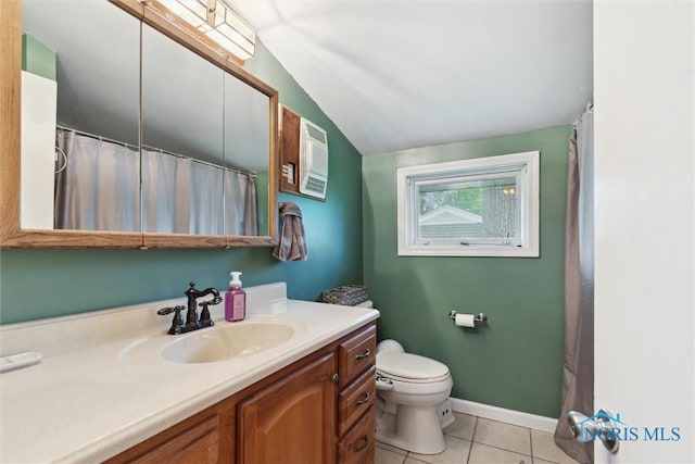 1639 Brookside Dr, Findlay, OH 45840 - bathroom with lofted ceiling, tile patterned flooring, vanity, and toilet