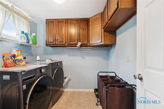 1639 Brookside Dr, Findlay, OH 45840 - washroom with washing machine and clothes dryer, cabinet space, light tile patterned floors, and baseboards