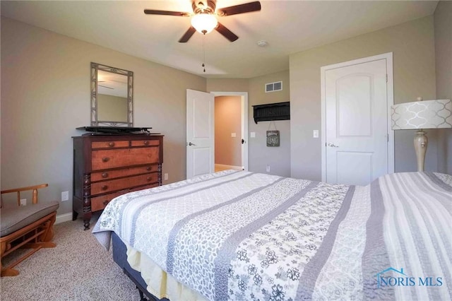 carpeted bedroom featuring a ceiling fan and baseboards