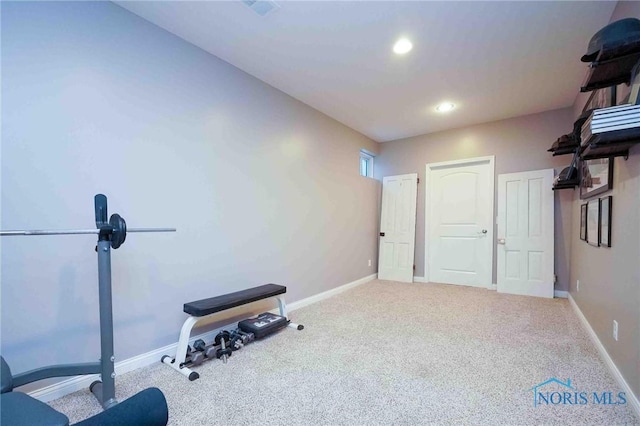 exercise area with carpet flooring, baseboards, and recessed lighting