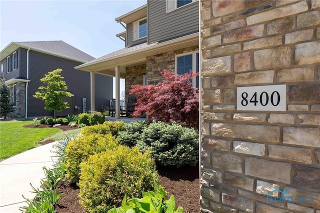 property entrance featuring stone siding
