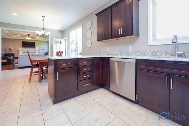 kitchen featuring dishwasher, a chandelier, light stone countertops, hanging light fixtures, and a peninsula