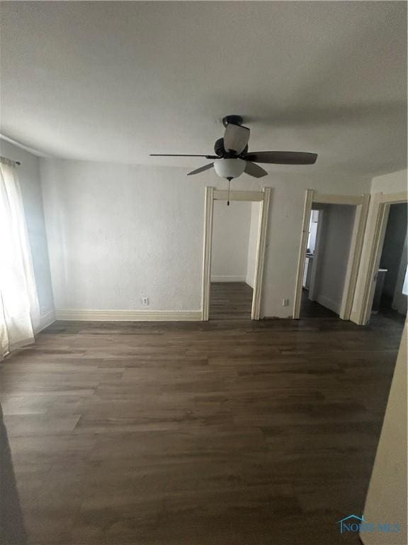 1566 Western Ave, Toledo, OH 43609 - spare room with wood finished floors, ceiling fan, and baseboards