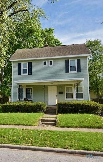 1587 Colton St, Toledo, OH 43609 - view of front of home featuring a front lawn and covered porch