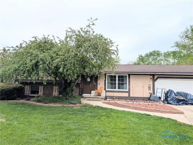 1270 S Park Ln, Wauseon, OH 43567 - ranch-style home featuring a garage, concrete driveway, and a front yard