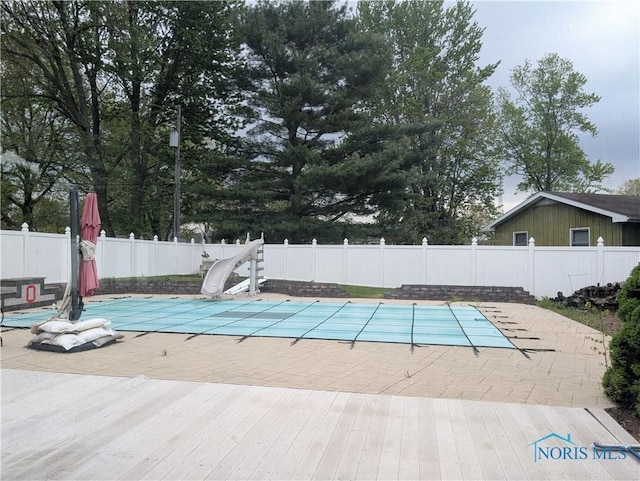 1270 S Park Ln, Wauseon, OH 43567 - view of swimming pool featuring a fenced backyard, a patio, and a water slide