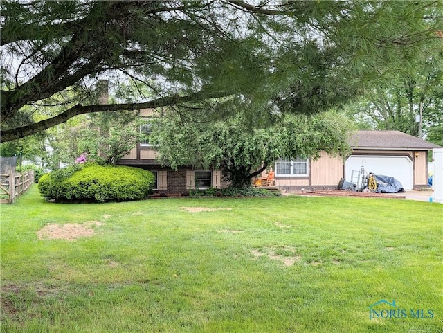 1270 S Park Ln, Wauseon, OH 43567 - view of grassy yard with an attached garage