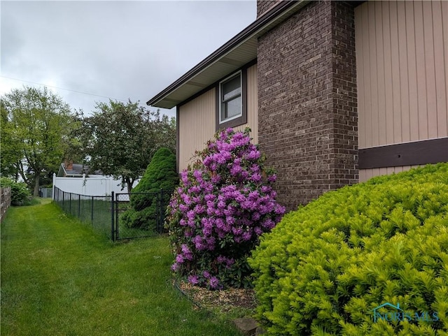 1270 S Park Ln, Wauseon, OH 43567 - view of side of property featuring a chimney and brick siding