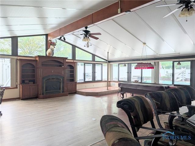 1270 S Park Ln, Wauseon, OH 43567 - living room with ceiling fan, wood finished floors, and a fireplace with raised hearth