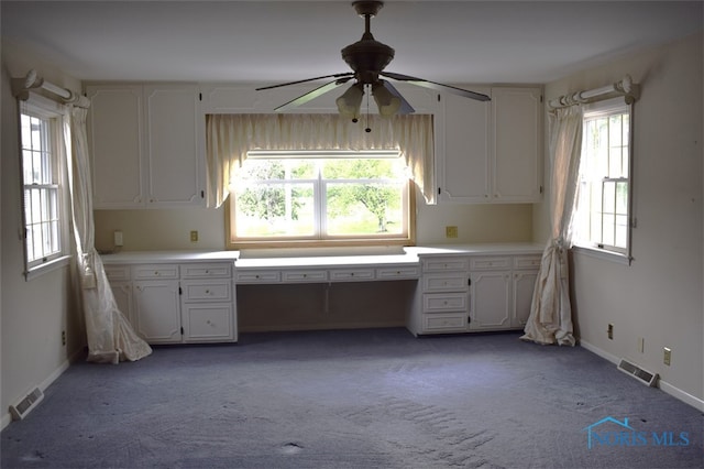 1527 S Ct, Findlay, OH 45840 - kitchen with a ceiling fan, white cabinetry, light countertops, and light carpet