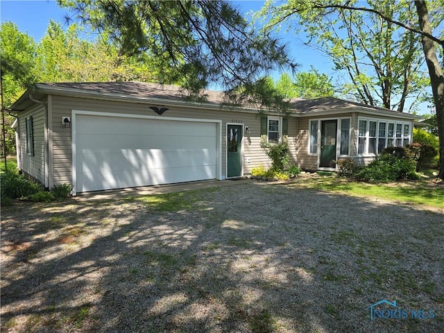 23423 Rd 104, Oakwood, OH 45873 - ranch-style home with a garage and driveway