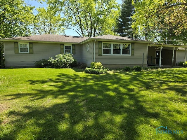 23423 Rd 104, Oakwood, OH 45873 - rear view of house with a lawn