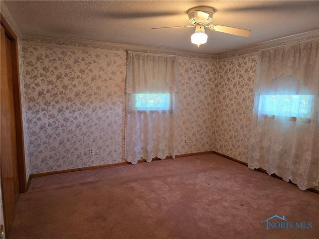 23423 Rd 104, Oakwood, OH 45873 - carpeted spare room with ceiling fan, wallpapered walls, and baseboards