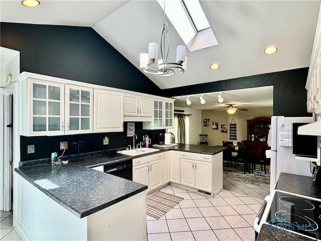 kitchen featuring a peninsula, a sink, light tile patterned floors, dark countertops, and recessed lighting