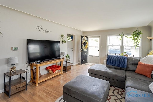 210 Willamont Rd, Toledo, OH 43612 - living room featuring light wood finished floors and baseboards