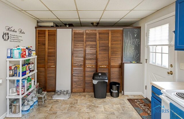 210 Willamont Rd, Toledo, OH 43612 - unfurnished office featuring a drop ceiling, light stone finish floors, and baseboards