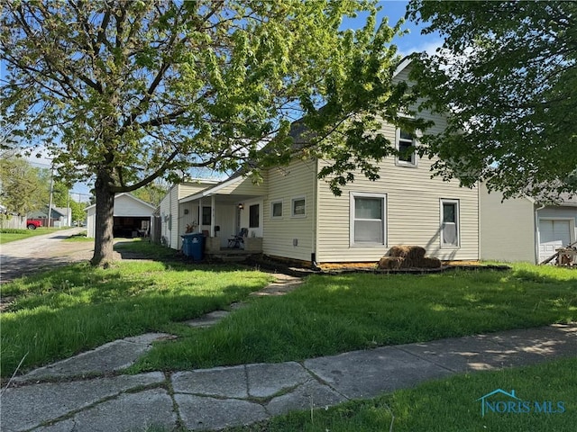 215 E Bryan St, Bryan, OH 43506 - view of front of house featuring a front yard
