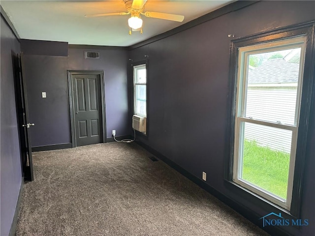 215 E Bryan St, Bryan, OH 43506 - carpeted spare room with plenty of natural light, ceiling fan, baseboards, and cooling unit