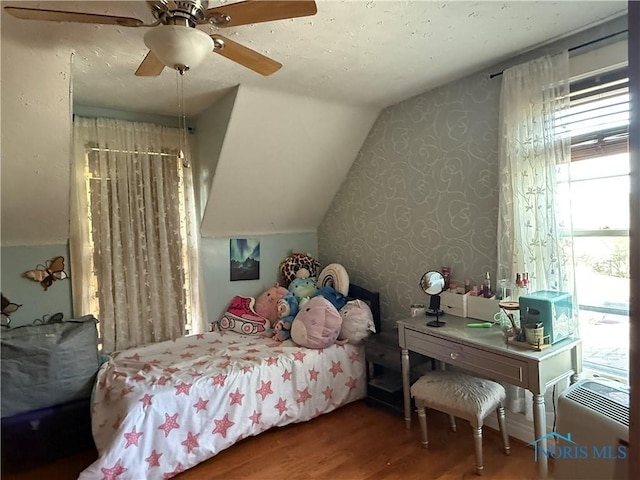 1023 Buckland Ave, Fremont, OH 43420 - bedroom featuring wallpapered walls, wood finished floors, vaulted ceiling, and ceiling fan