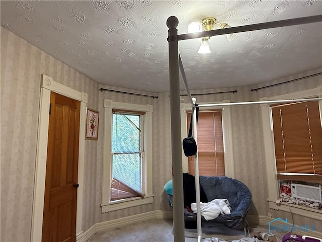 1023 Buckland Ave, Fremont, OH 43420 - interior space with baseboards, wallpapered walls, cooling unit, and carpet floors