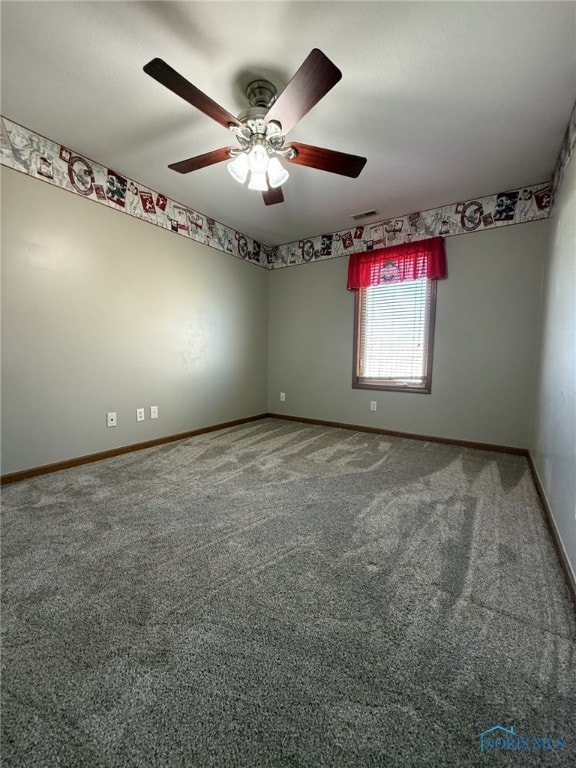 512 Fugate Dr, Defiance, OH 43512 - unfurnished room featuring baseboards, a ceiling fan, and carpet flooring