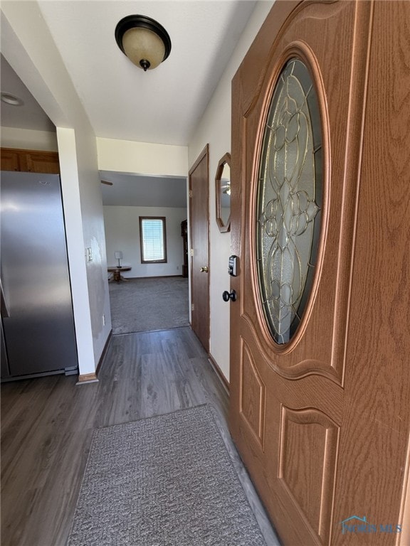 512 Fugate Dr, Defiance, OH 43512 - foyer with dark wood-style floors and baseboards