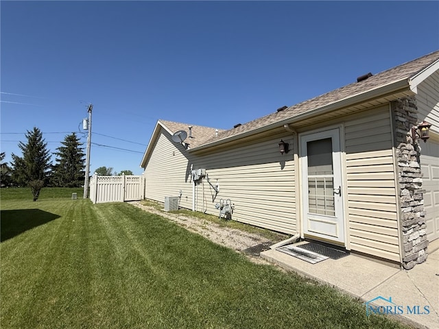 512 Fugate Dr, Defiance, OH 43512 - back of house with an attached garage and roof with shingles