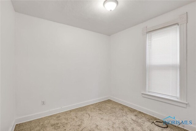 308 Crittenden Ave, Toledo, OH 43609 - empty room featuring carpet floors and baseboards