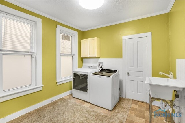 308 Crittenden Ave, Toledo, OH 43609 - laundry area with cabinet space, independent washer and dryer, crown molding, and baseboards