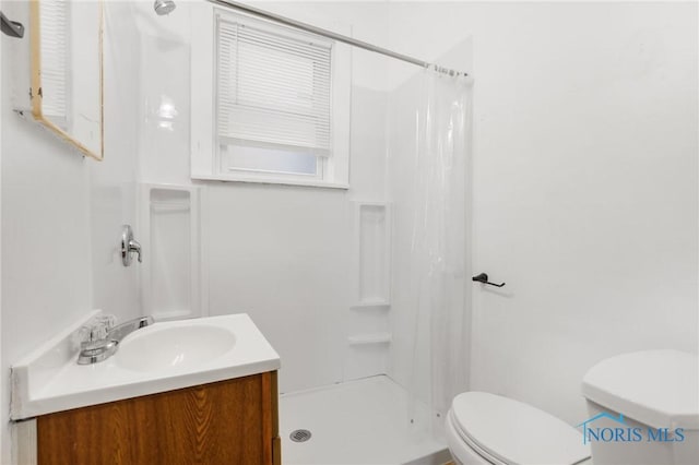 308 Crittenden Ave, Toledo, OH 43609 - bathroom with toilet, a shower stall, and vanity