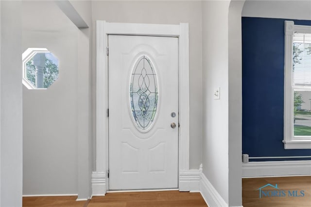 308 Crittenden Ave, Toledo, OH 43609 - foyer entrance featuring wood finished floors, baseboards, and arched walkways
