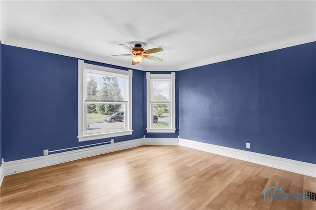308 Crittenden Ave, Toledo, OH 43609 - empty room with ceiling fan, wood finished floors, and baseboards