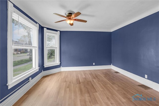 308 Crittenden Ave, Toledo, OH 43609 - empty room with ceiling fan, wood finished floors, and baseboards