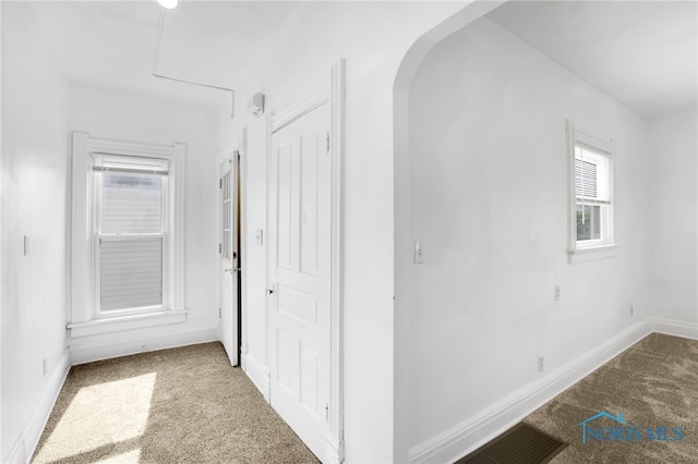 308 Crittenden Ave, Toledo, OH 43609 - hallway with carpet flooring, arched walkways, and baseboards