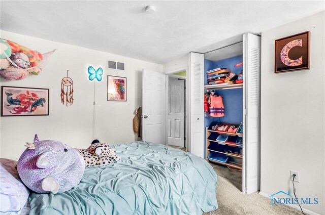 5956 E Pembridge Dr, Toledo, OH 43615 - carpeted bedroom featuring a closet and baseboards