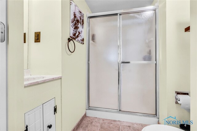5956 E Pembridge Dr, Toledo, OH 43615 - full bath with a stall shower, vanity, tile patterned floors, and toilet