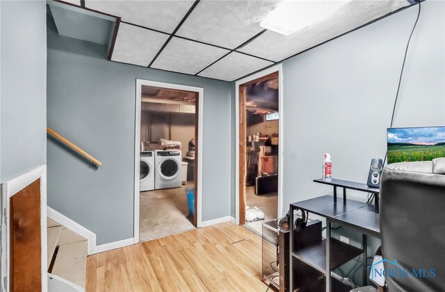 5956 E Pembridge Dr, Toledo, OH 43615 - office area featuring washing machine and clothes dryer, wood finished floors, baseboards, and a drop ceiling