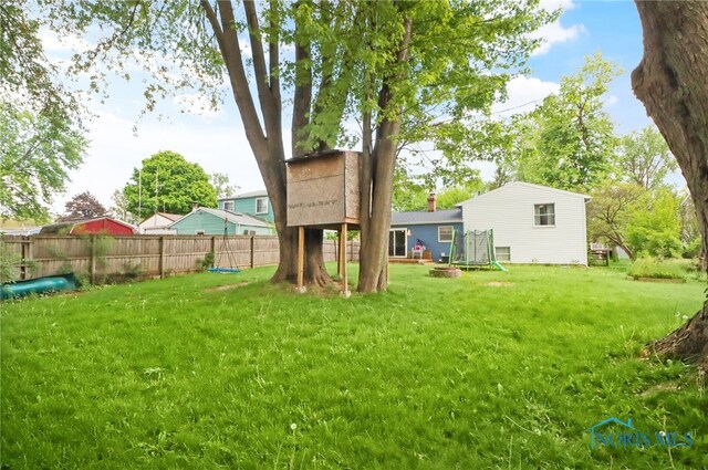 5956 E Pembridge Dr, Toledo, OH 43615 - view of yard featuring a trampoline