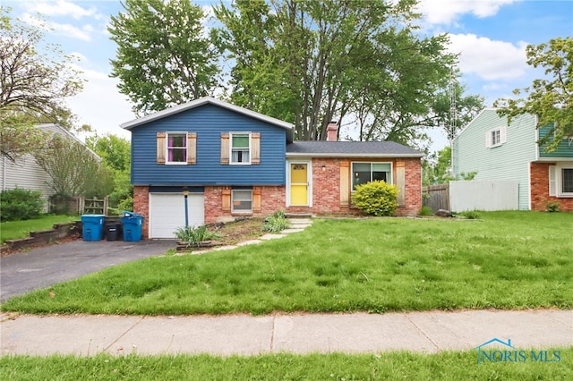 5956 E Pembridge Dr, Toledo, OH 43615 - split level home with brick siding, a garage, driveway, and a chimney