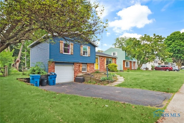 5956 E Pembridge Dr, Toledo, OH 43615 - tri-level home featuring brick siding, asphalt driveway, a front yard, and a garage