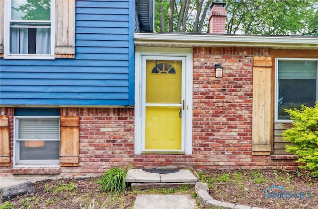 5956 E Pembridge Dr, Toledo, OH 43615 - entrance to property featuring brick siding and a chimney